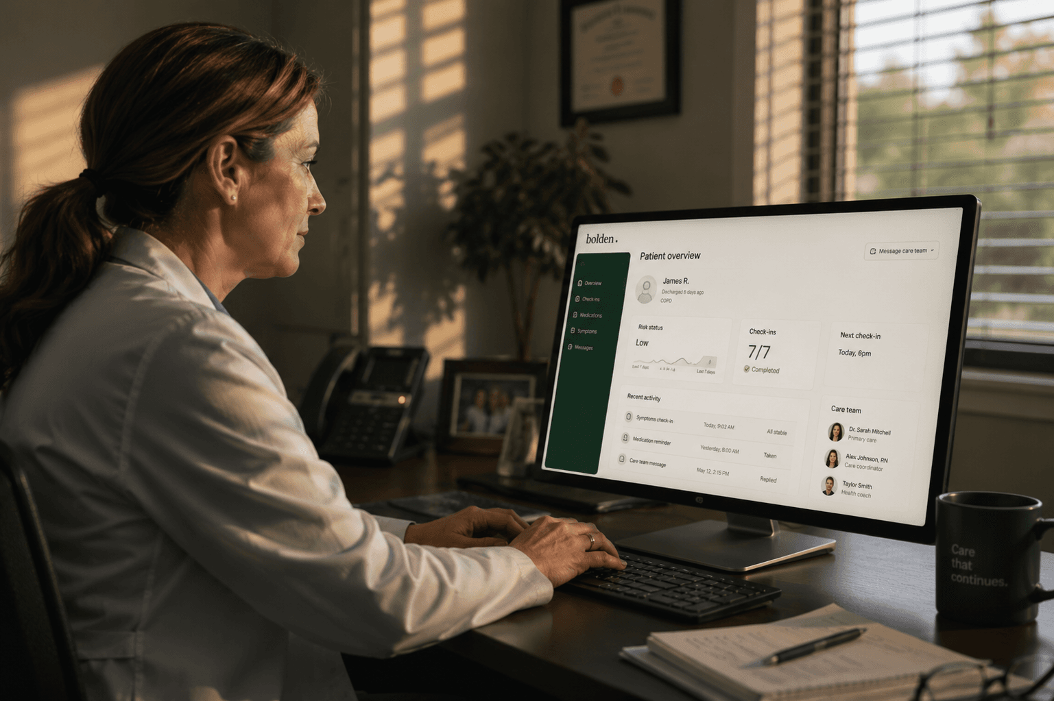 Clinician reviewing a Bolden patient overview dashboard at her desk in afternoon light